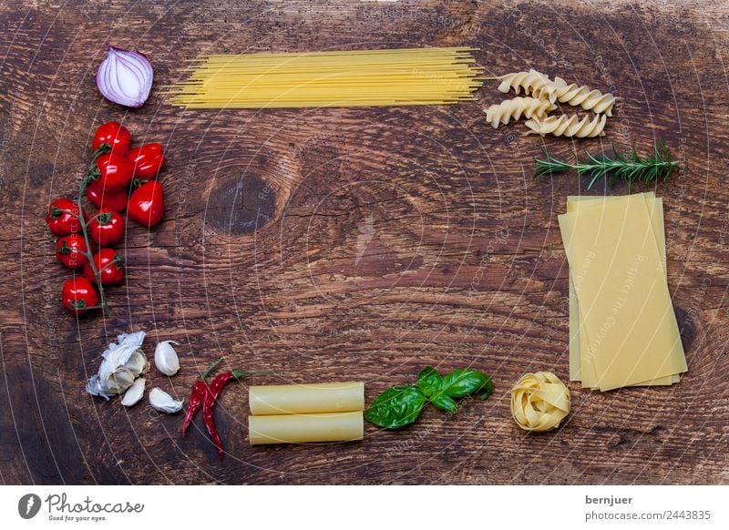 Frame of pasta and ingredients Cheese Vegetable Herbs and spices Vegetarian diet Decoration Table Leaf Wood Fresh Noodles Spaghetti spirelli Eating boil