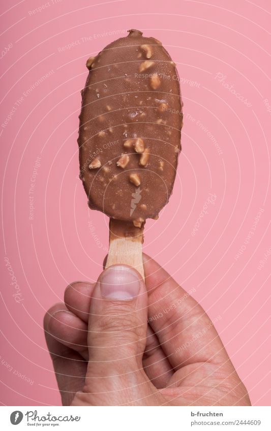 Ice on a stick Ice cream Man Adults Hand Fingers Eating To hold on Fresh Brown Pink To enjoy popsicle Broomstick Summer Cold Almond Chocolate Icing Overlay