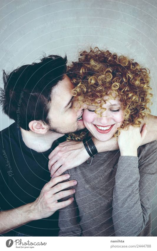 Young couple's feet together with funny drawn happy, smiling faces