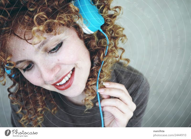 Blonde woman listening to music with her headphones Lifestyle Style Joy Beautiful Hair and hairstyles Skin Face Wellness Well-being Leisure and hobbies Headset