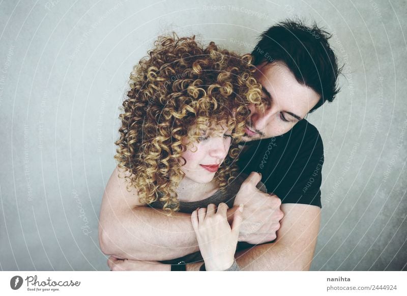 Studio portrait of young couple hugging Elegant Style Joy Wellness Well-being Senses Human being Masculine Feminine Woman Adults Man Family & Relations Couple