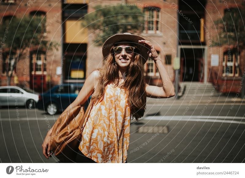 Blonde thin woman with hat and sunglasses visiting the city during the day. Lifestyle Style Joy Beautiful Body Leisure and hobbies Vacation & Travel City trip