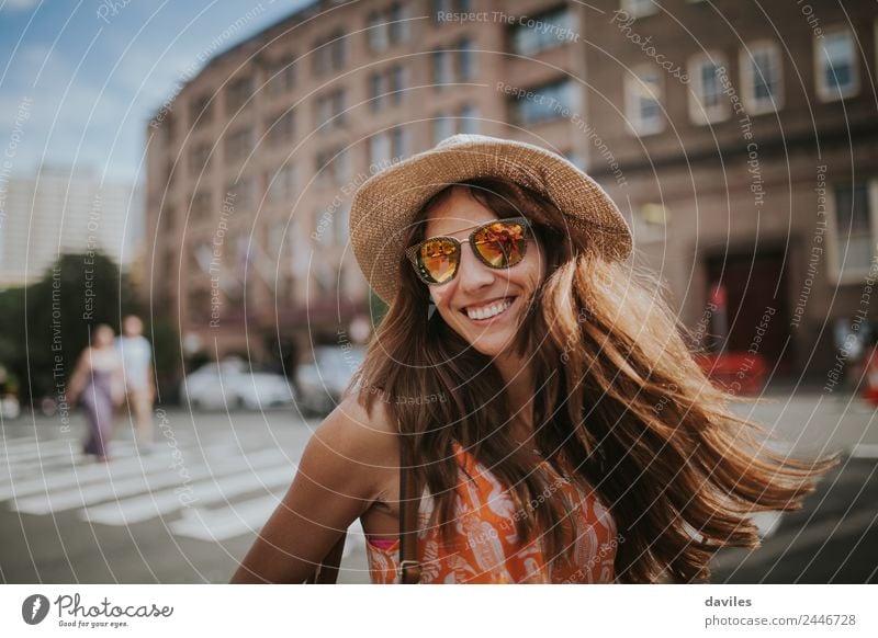 Long hair girl with hat and sunglasses walking in Sydney city streets in Australia. Lifestyle Leisure and hobbies Vacation & Travel Tourism Trip Human being