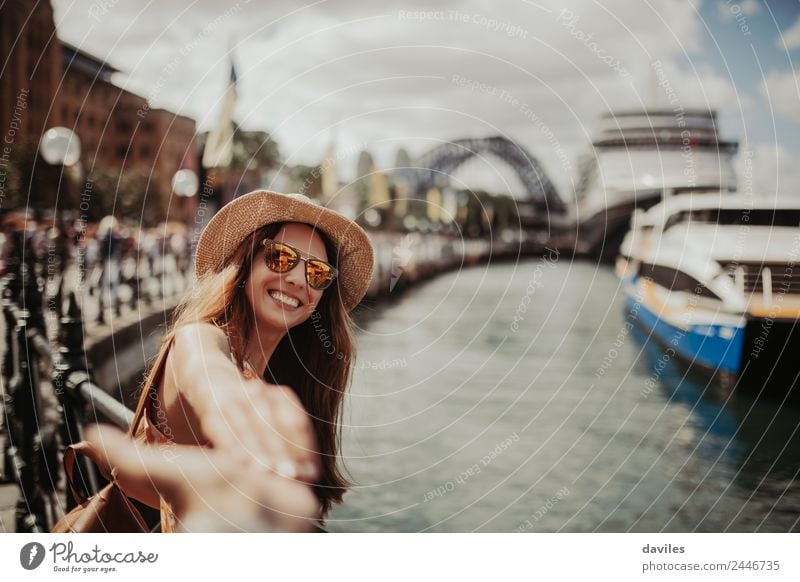 Cute woman in hat and sunglasses holding her boyfriend hand in Sydney city, Australia. Lifestyle Joy Vacation & Travel Trip Adventure City trip Human being