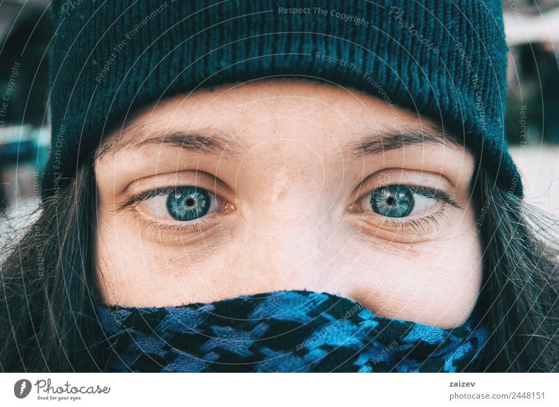 Blue-eyed girl in a winter hat playing dumb with her eyes Lifestyle Joy Happy Beautiful Face Relaxation Winter Christmas & Advent Human being Feminine