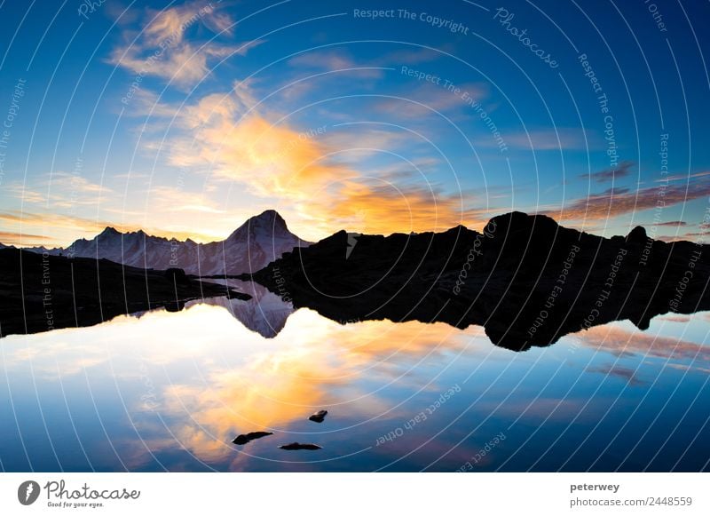 Bietschorn mountain peak at sunrise Summer Mountain Nature Landscape Sky Clouds Rock Alps Pond Lake Blue Switzerland Alpine clear Height loetschenpass