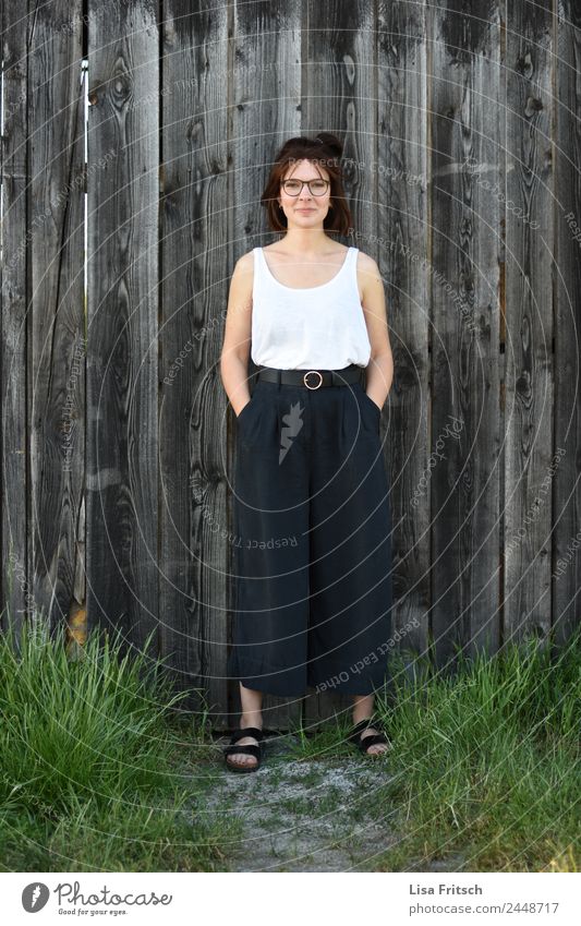 STANDING IN FRONT OF A WOODEN WALL - WOMAN - SELF-CONFIDENT pretty Feminine Young woman Youth (Young adults) 1 Human being 18 - 30 years Adults Fashion
