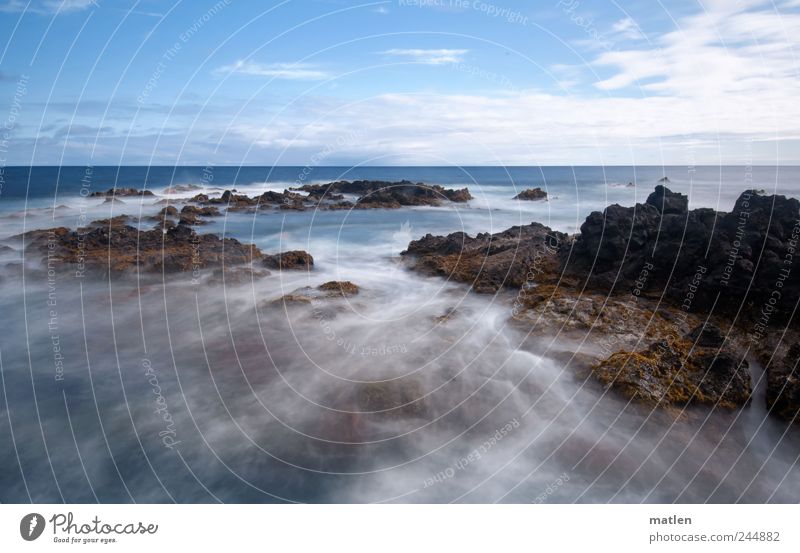 everything flows Nature Landscape Elements Air Water Drops of water Sky Clouds Summer Weather Rock Waves Coast Reef Ocean Esthetic Wild Blue Brown White Bizarre