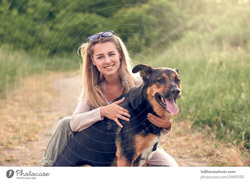 Happy smiling dog with its pretty young owner Lifestyle Joy Beautiful Leisure and hobbies Playing Summer Woman Adults Friendship 1 Human being 18 - 30 years