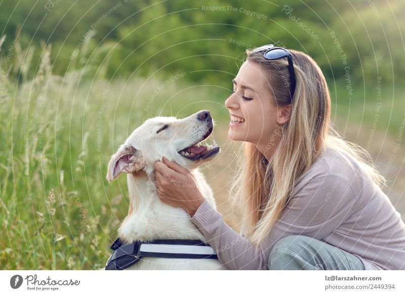 Happy smiling dog with its pretty young owner Lifestyle Joy Beautiful Leisure and hobbies Playing Summer Woman Adults Friendship 1 Human being 18 - 30 years