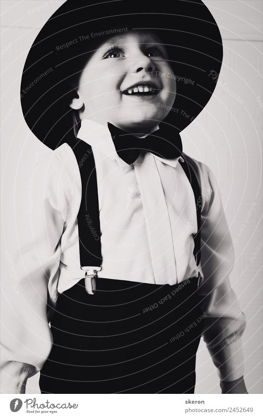 stylish little gentleman in hat looking up Human being Masculine Child Baby Infancy Hair and hairstyles Face Eyes Mouth Lips Teeth 1 1 - 3 years Toddler Culture