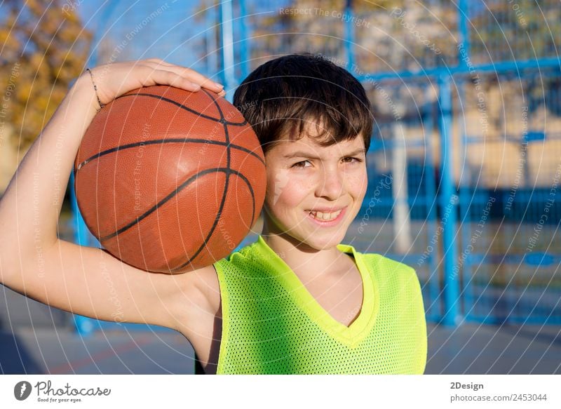 Young basketball player standing on the cour Lifestyle Joy Relaxation Leisure and hobbies Playing Sports Ball Human being Masculine Boy (child) Young man
