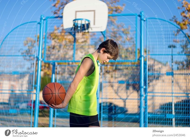 Young basketball player standing on the court wearing a yellow sleeveless Lifestyle Joy Relaxation Leisure and hobbies Playing Sports Ball Human being Masculine