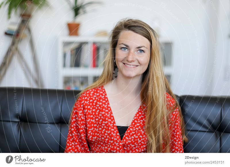 smiling young woman lying on sofa at home Lifestyle Happy Beautiful Calm Leisure and hobbies House (Residential Structure) Sofa Human being Feminine Young woman