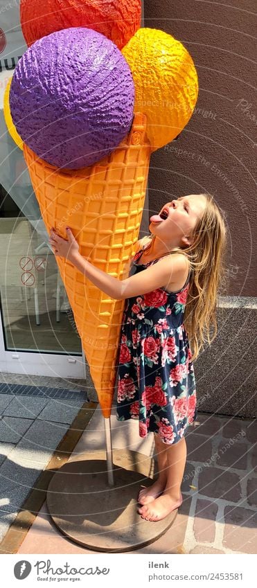 Girl with ice Child Family & Relations 1 Human being 3 - 8 years Infancy Summer Beautiful weather Dress Blonde Long-haired Sphere Touch Eating