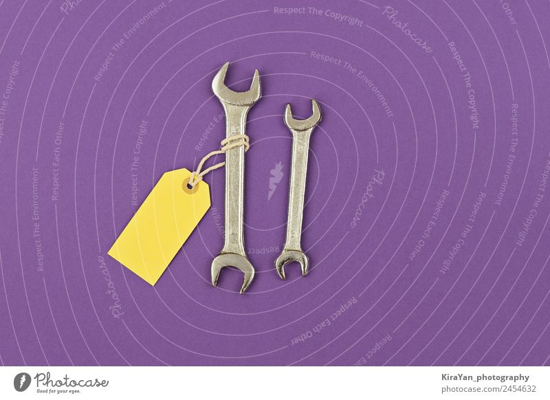 Two wrench large and small with price tag purple background Lifestyle Design Happy Decoration Feasts & Celebrations Tool Masculine Man Adults Father