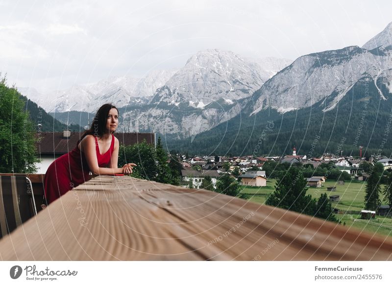 Young woman enjoying the view of the alps from a balcony Feminine Youth (Young adults) Woman Adults 1 Human being 18 - 30 years 30 - 45 years Nature Relaxation