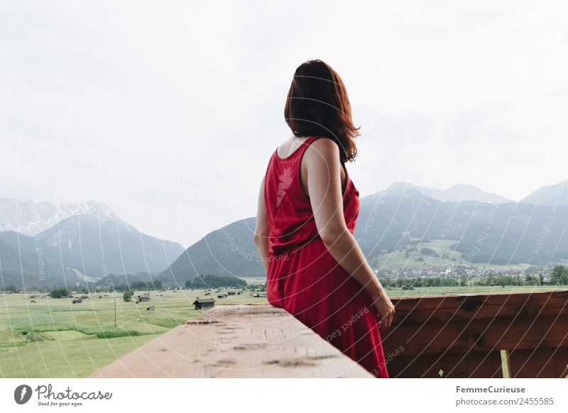 Young woman enjoying the view of the alps from a balcony Feminine Youth (Young adults) Woman Adults 1 Human being 18 - 30 years 30 - 45 years Nature Relaxation