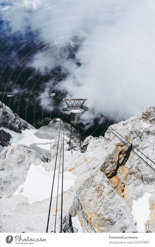 Ropes of a cable car in the alps Nature Adventure Experience Cable car Gondola Ferris wheel Alps Stone Clouds Fog Impressive Travel photography
