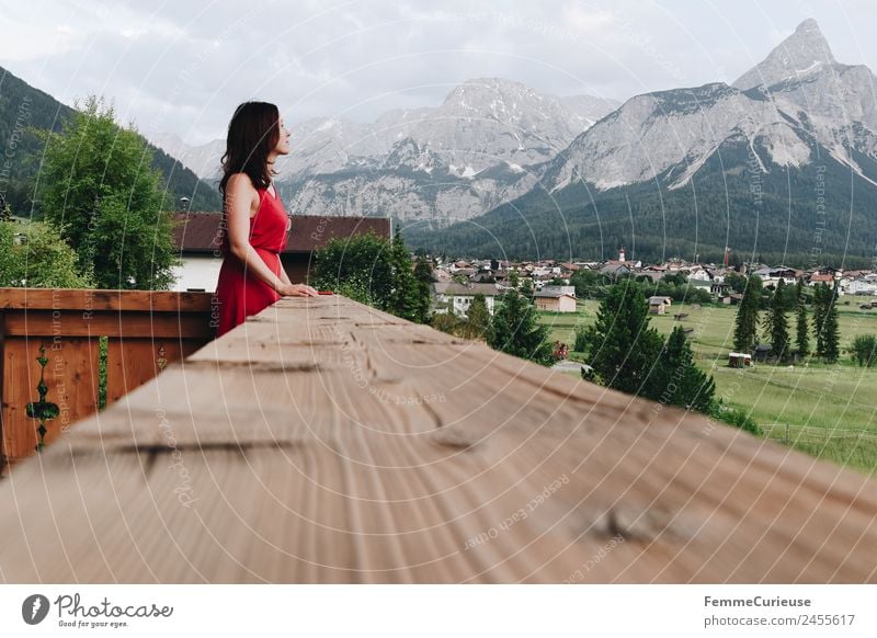 Young woman on the balcony who enjoys the view of the mountains Feminine Youth (Young adults) Woman Adults 1 Human being 18 - 30 years 30 - 45 years Nature