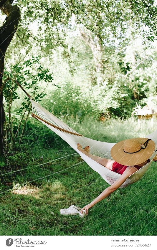 Young woman relaxing in a hammok Feminine Youth (Young adults) Woman Adults 1 Human being 18 - 30 years 30 - 45 years Relaxation Sunhat Hammock Summer