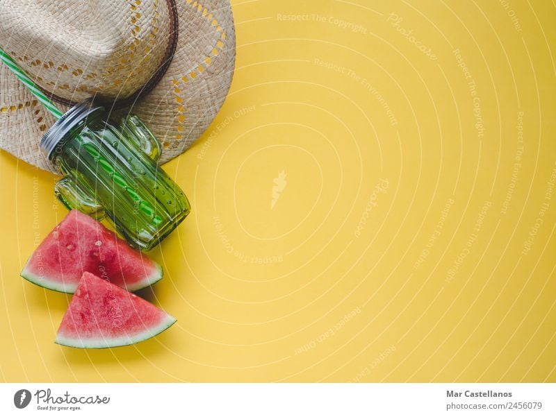 Summer composition on yellow background. Fruit Nutrition Juice Vacation & Travel Beach Ocean Table Nature Fashion Hat Write Fresh Delicious Juicy Yellow Green