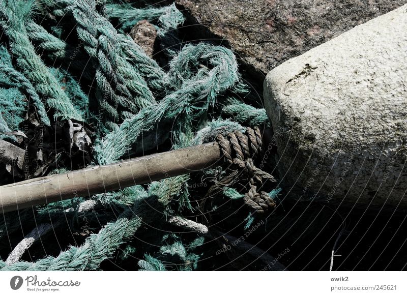 Svanhalla Closing time Harbour Stone Old Near naturally Gloomy Gray Black White Calm Peaceful Things Rope Knot Material Anchoring ground Colour photo