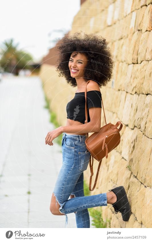 Happy mixed woman with afro hair standing outdoors. Lifestyle Style Joy Beautiful Hair and hairstyles Face Human being Young woman Youth (Young adults) Woman