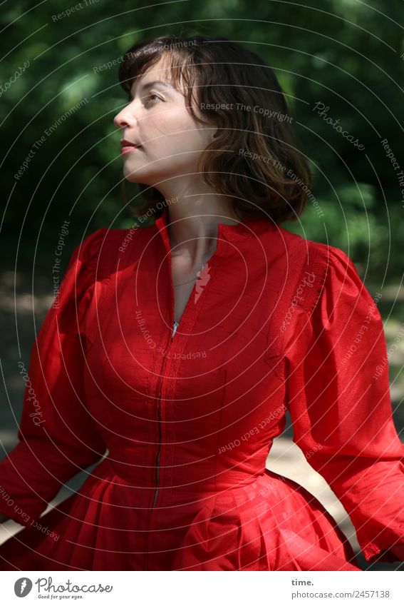 ulreka Feminine Woman Adults 1 Human being Beautiful weather Park Dress Brunette Long-haired Bangs Observe Rotate Looking Stand Red Self-confident Watchfulness
