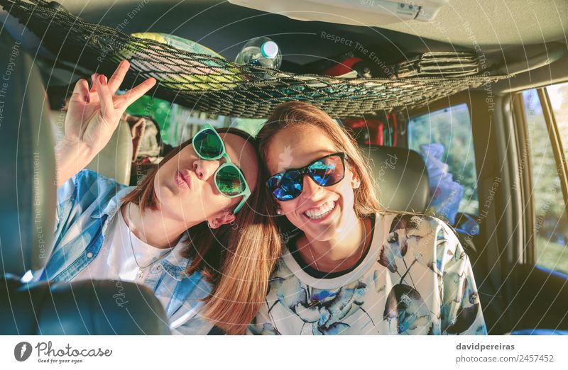 Happy women laughing and having fun inside of car Lifestyle Joy Beautiful Leisure and hobbies Vacation & Travel Trip Adventure Success Human being Woman Adults