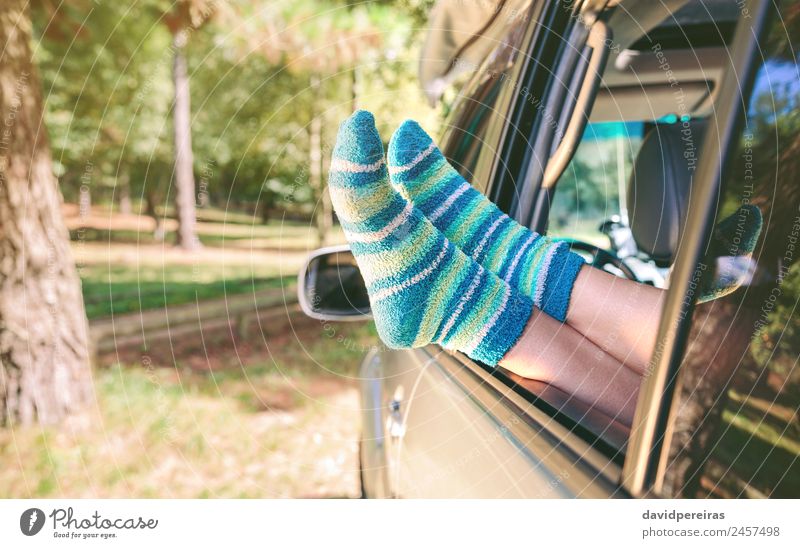 Female legs with socks resting over open window car Lifestyle Beautiful Relaxation Leisure and hobbies Vacation & Travel Trip Freedom Summer Human being Woman
