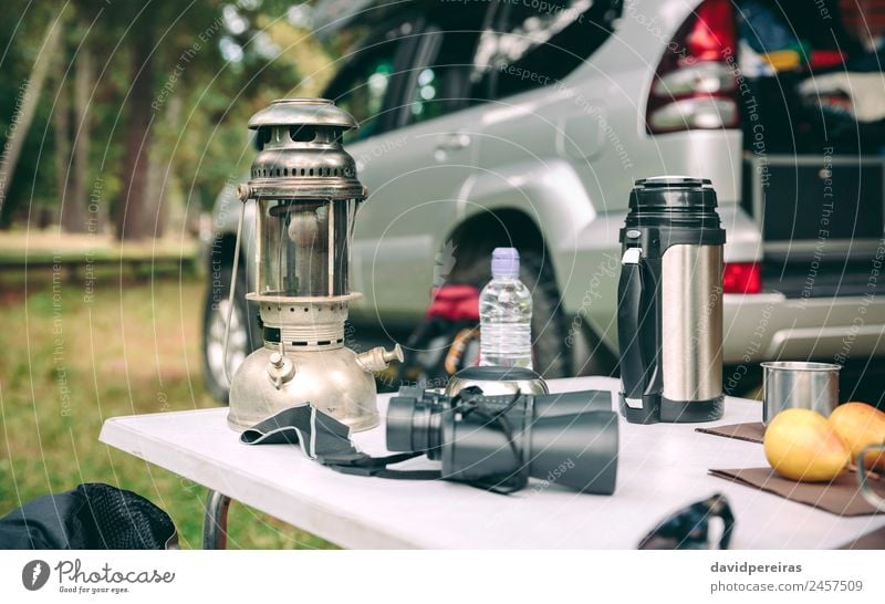 Oil lamp, thermos and binoculars over camping table Fruit Coffee Lifestyle Joy Relaxation Leisure and hobbies Vacation & Travel Tourism Trip Adventure Camping