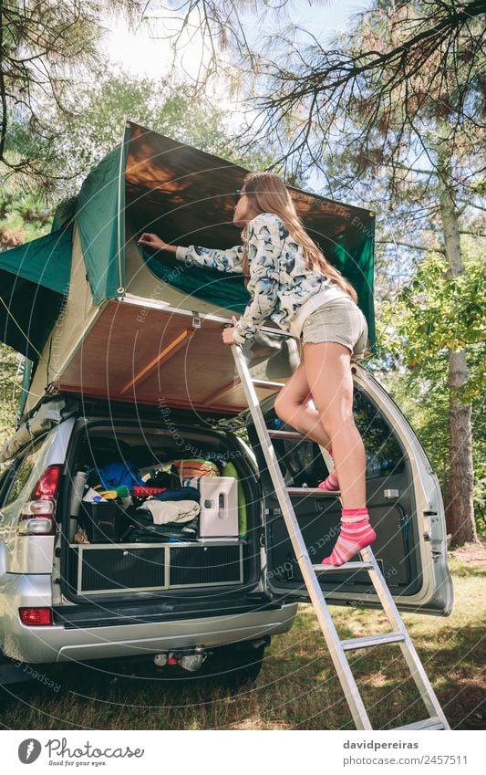 Woman standing in ladder opening tent over car Lifestyle Joy Happy Relaxation Leisure and hobbies Vacation & Travel Trip Adventure Camping Summer Mountain