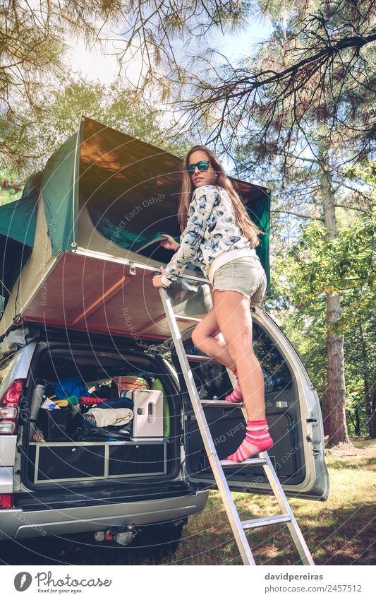 Woman standing in ladder opening tent over car Lifestyle Joy Happy Relaxation Leisure and hobbies Vacation & Travel Trip Adventure Camping Summer Mountain