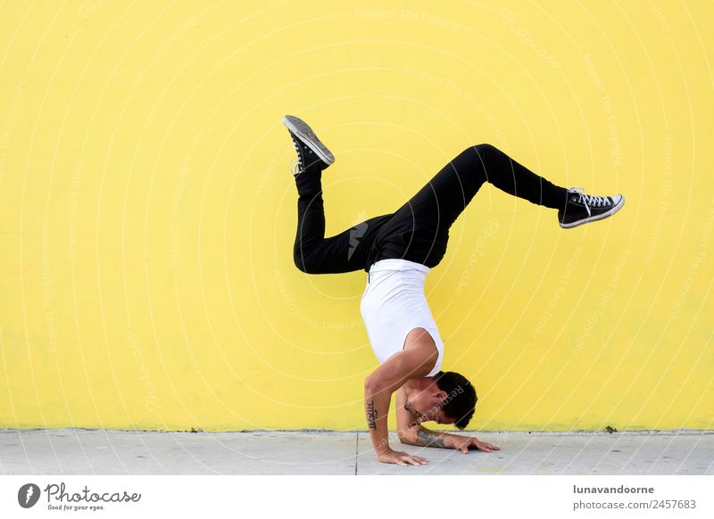 Man practicing yoga, forearm balance on a yellow wall Lifestyle Healthy Athletic Fitness Wellness Sports Sports Training Sportsperson Yoga Dance Human being