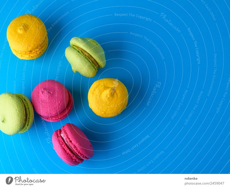 baked cakes of almond flour macarons Cake Dessert Candy Eating Bright Blue Yellow Green Pink Colour Macaron background food colorful Vanilla french