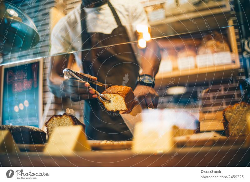 African man works in pastry shop. Dessert Breakfast Happy Work and employment Business Man Adults Smiling Fresh Small Delicious Black Self-confident Pride