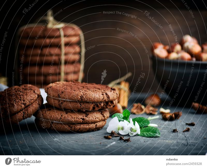 stack of round chocolate cookies Cake Dessert Candy Nutrition Flower Eating Dark Delicious Brown Black background food Stack sweet Baking biscuit Tasty Snack