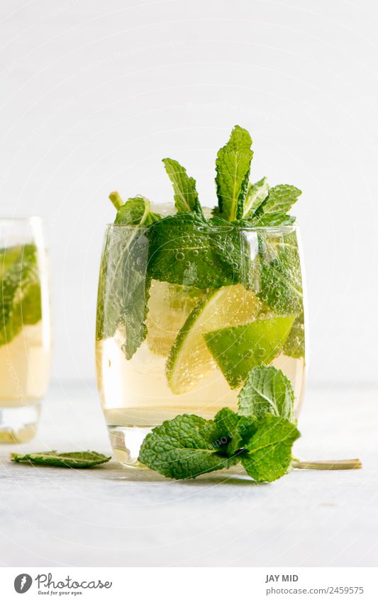 mojito cocktail with rum, lime and soda Fruit Herbs and spices Beverage Cold drink Lemonade Juice Alcoholic drinks Longdrink Cocktail Glass Exotic Summer Table