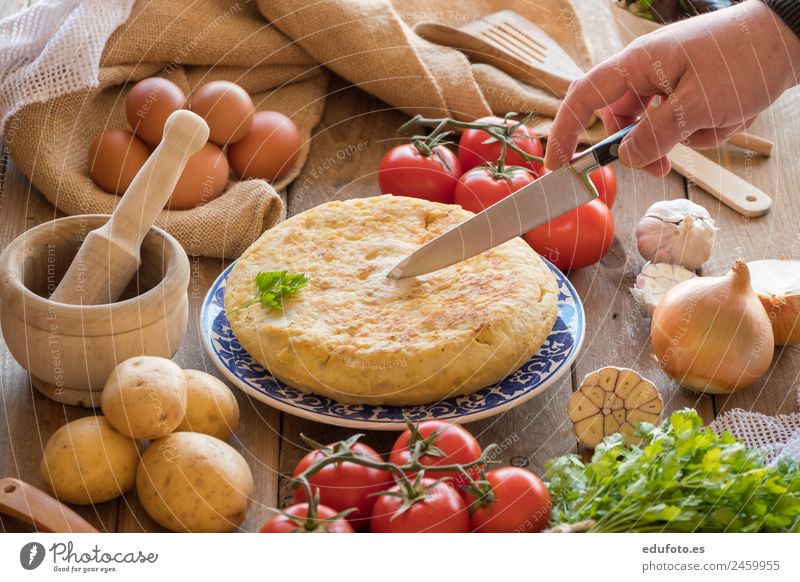 Chef cutting a traditional spanish omelette Vegetable Nutrition Lunch Dinner Plate Lifestyle Healthy Eating Restaurant Natural Green White Spain Baking Basil
