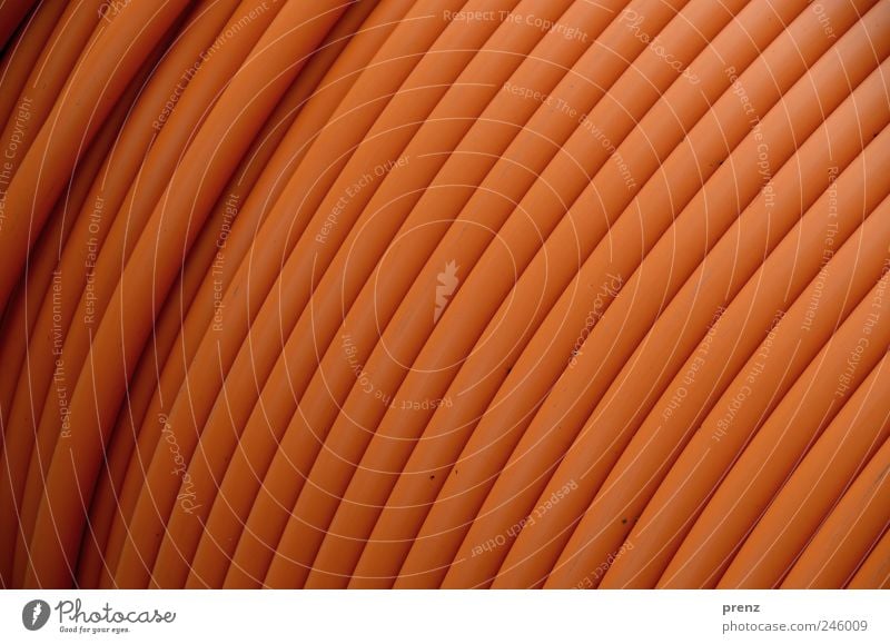 plastic design Plastic Brown Pipe Transmission lines Cable Line Wound up Colour photo Exterior shot Close-up Light Shallow depth of field Central perspective