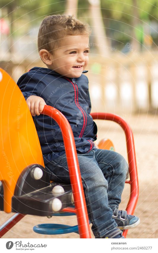 Cute boy playing in the park Joy Happy Face Playing Child Baby Toddler Boy (child) Infancy Mouth Sand Park Blonde Toys Smiling Friendliness Funny New Crazy Wild