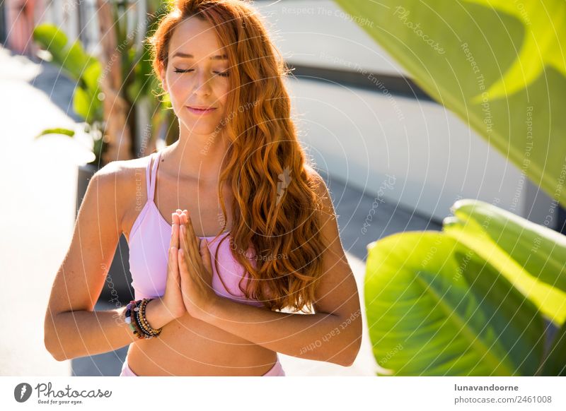 Spanish woman meditating in a tropical background Lifestyle Joy Sports Fitness Sports Training Yoga Young man Youth (Young adults) Woman Adults 1 Human being