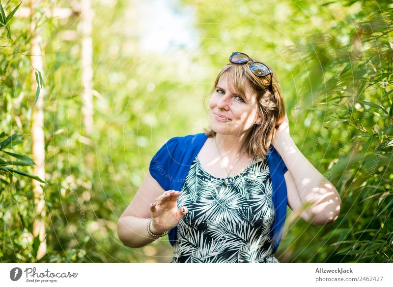 Portrait of a young woman in the bamboo jungle Portrait photograph Young woman 1 Person Woman Feminine Blonde Green Nature Day Bamboo Bushes Leaf Forest