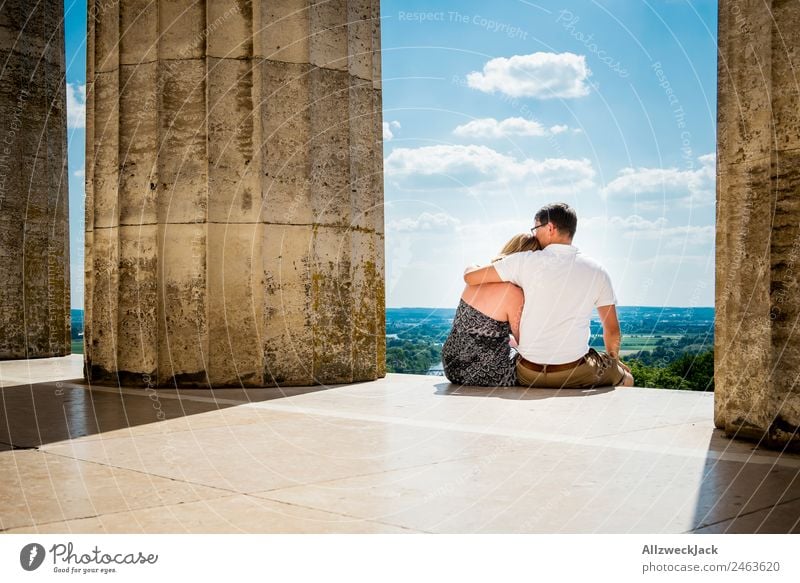 Couple Sits Arm In Arm And Enjoys The View A Royalty Free Stock Photo From Photocase