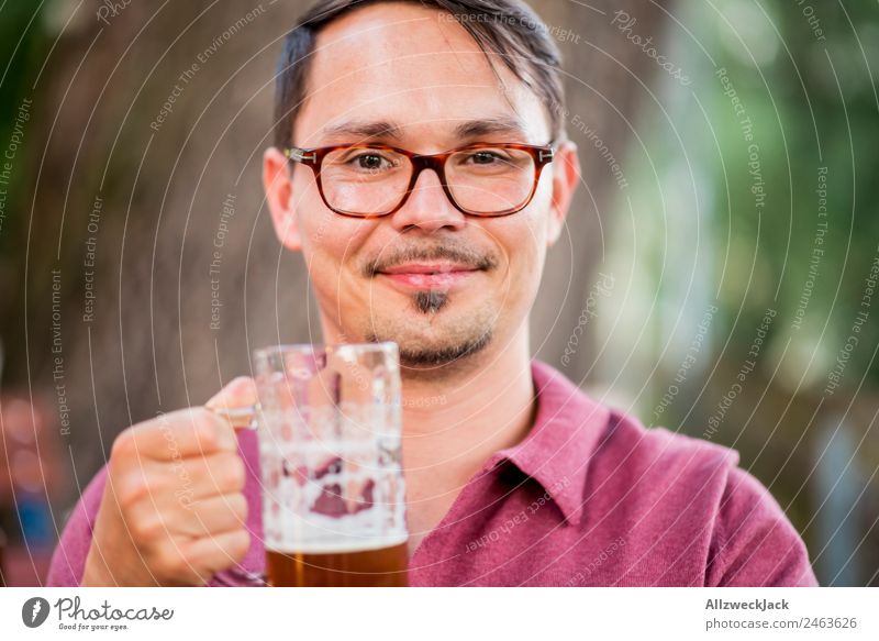 Portrait of a young man with a beer glass in his hand Portrait photograph 1 Person Young man Upper body Looking into the camera Beer glass Beer mug