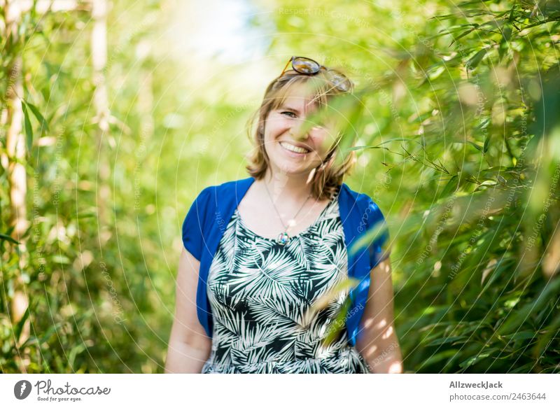 Portrait of a young woman in the bamboo jungle Portrait photograph Young woman 1 Person Woman Feminine Blonde Green Nature Day Bamboo Bushes Leaf Forest