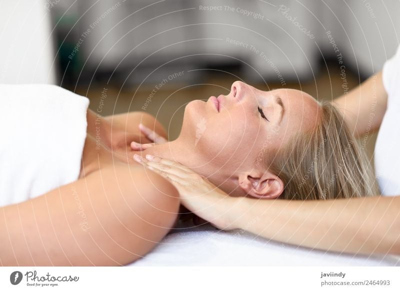 Young blond woman receiving a head massage in a spa center Beautiful Face Health care Wellness Relaxation Spa Massage Human being Feminine Young woman
