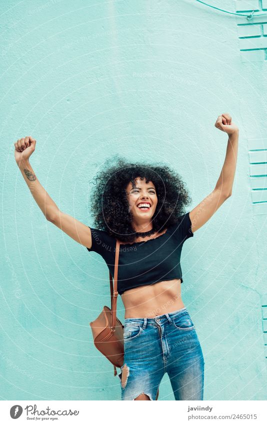 Funny black woman with afro hair raising arms outdoors. Lifestyle Style Joy Happy Beautiful Hair and hairstyles Face Human being Feminine Young woman