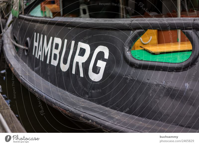 Close-up of a ship with the name of the Hanseatic City of Hamburg Port of Hamburg Navigation Hull Transport Trade Characteristic travel Town vacation